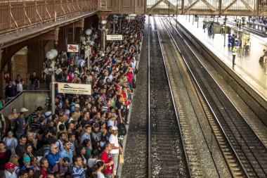 Sao Paulo, Brazil, August 02, 2012. People waiting train at the boarding platform of the Luz station of the CPTM, in the central region of Sao Paulo clipart