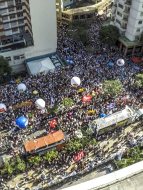 Sao Paulo, Brazil, March 16, 2018. Aerial view of the demonstration of municipal civil servants who are against the increase of the discount in the salaries to pay the retirements, in front of the building of the City Hall of Sao Paulo, where a publi clipart