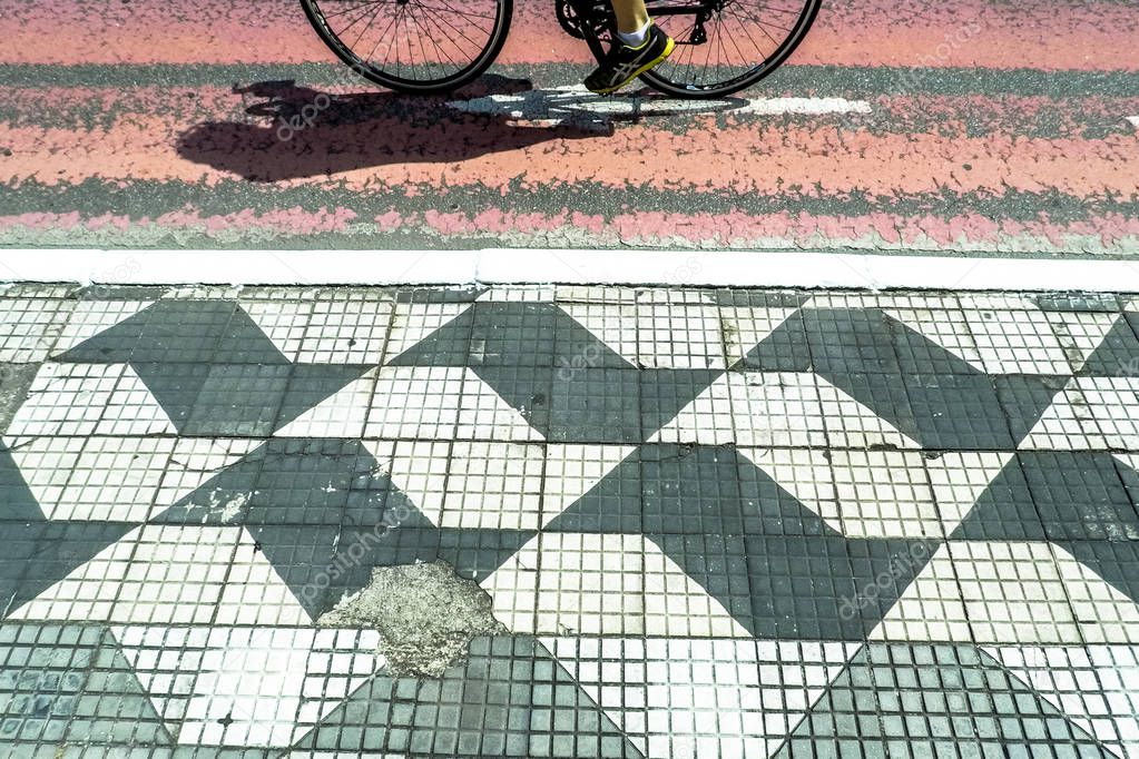 Sao Paulo, Brazil, April 14, 2018. Traffica and view of bike path in Liberdade Avenue, in downtown Sao Paulo