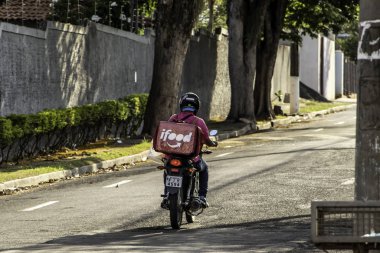 Marilia, Sao Paulo, Brazil, October 20, 2019. worker ifood on the motorcycle delivers food to customers in Marilia city.