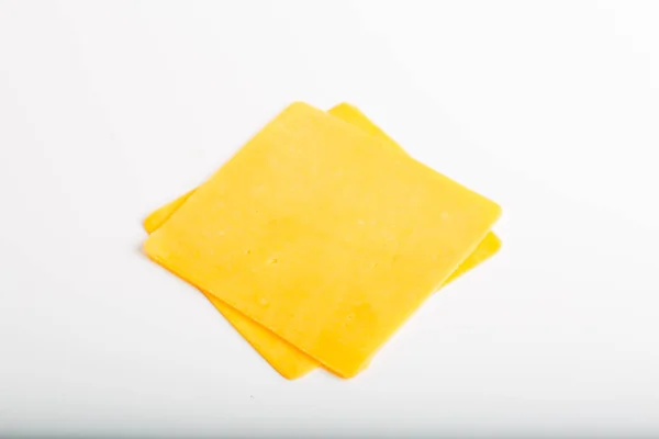 Cheddar cheese slices close up — Stock Photo, Image