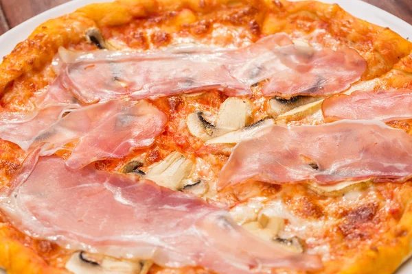tasty ham and mushroom pizza