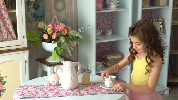 Little girl sets the table. Small hostess is waiting for guests — Stock Video