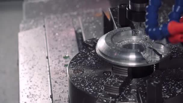Drill milling shapes out of a metal piece on a CNC machine — Stock Video