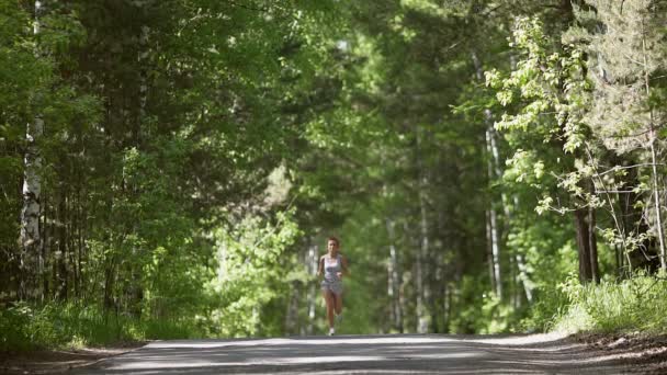 Woman jogging in the morning attractive girl do sport outdoor. slow motion — Stock Video