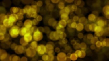 Bokeh parlayan ile arka plan parıldıyor. Altın parçacıkları glitter.