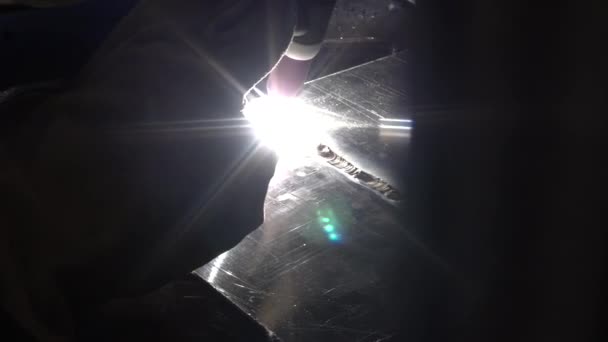 Welder at work in metal industry. Welding on an industrial plant — Stock Video