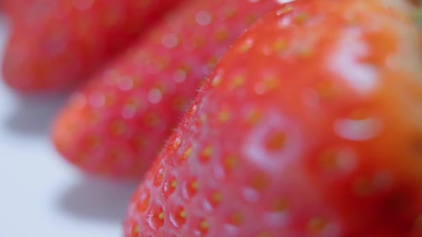 Strawberry in a macro shot with slowly moving camera — Stock Video