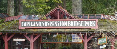 Famous Capilano Suspension Bridge Park in North Vancouver - VANCOUVER - CANADA - APRIL 12, 2017 clipart