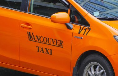 Vancouver Taxi Cabs in the city - VANCOUVER - CANADA - APRIL 12, 2017 clipart