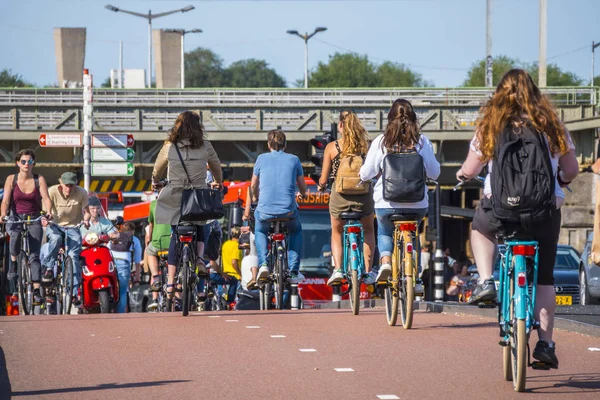 Amsterdam - a city full of bikers - typical view — Stock Photo, Image