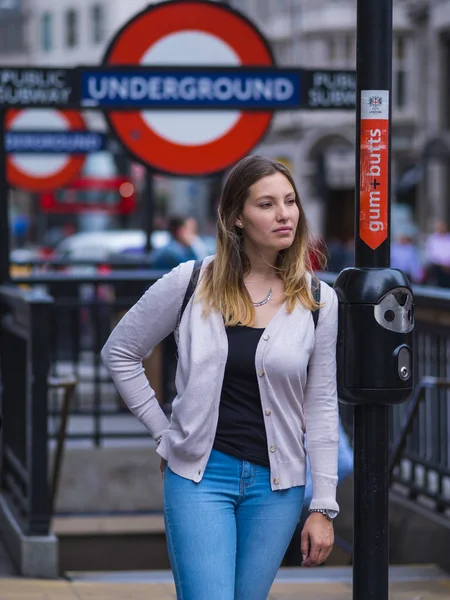 Typical view at Piccadilly Circus London - tourists at an underground station — Stock Photo, Image