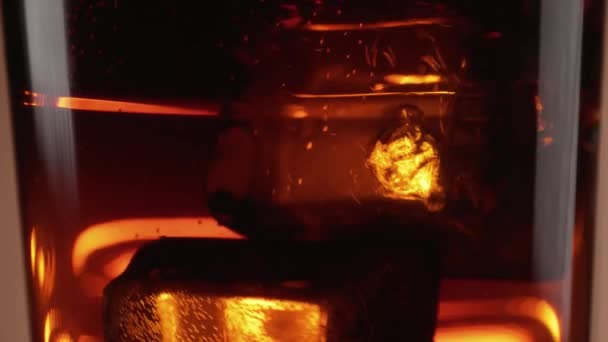 Close up shot of Cola on ice in slow motion — Stock Video