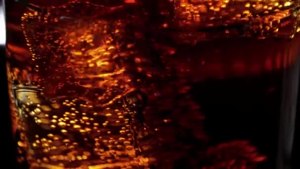 Amazing shot of ice cubes in Cola - perfect background of refreshing soda — Stock Video