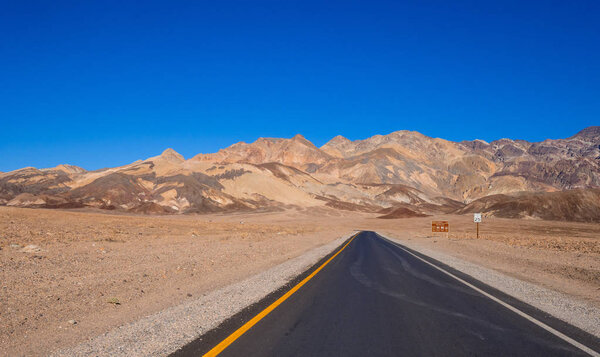 Road through the desert of Death Valley in California