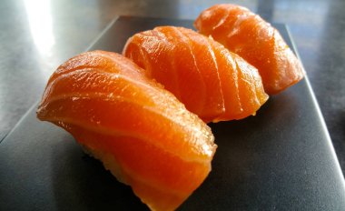Sake nigiri sushi - close up shot - fresh salmon clipart