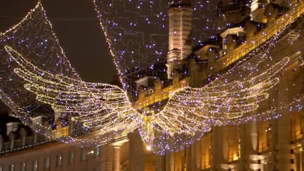 Light angels at Regent Street London for Christmas time - LONDON, ENGLAND - DECEMBER 10, 2019 — Stock Video