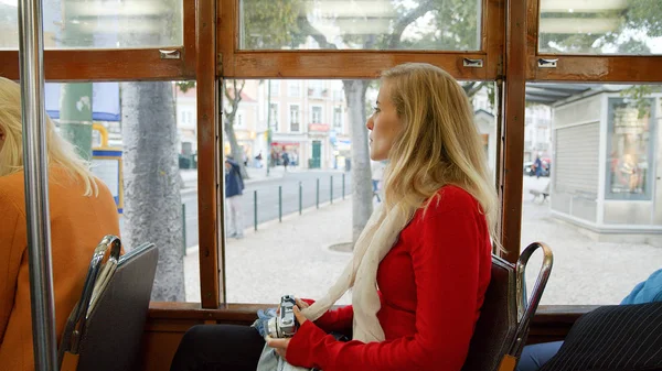 Riding the famous tram of Lisbon - LISBON, PORTUGAL - OCTOBER 15, 2019