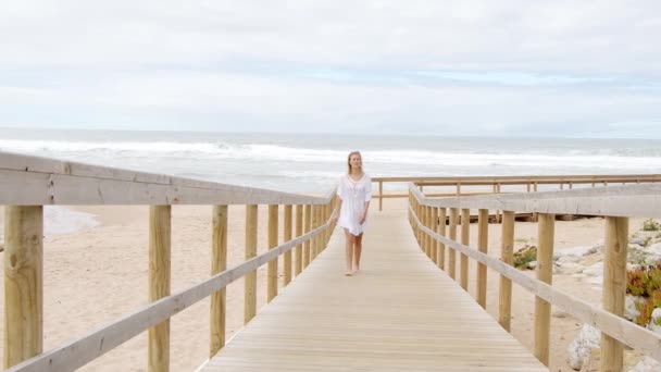 Young and sexy woman at the beach - summer vacation — Stock Video