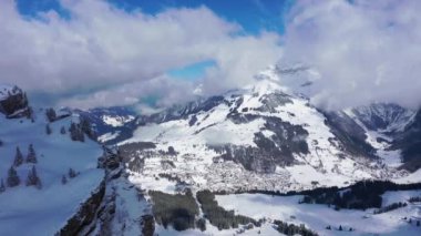 Aerial footage of wonderful snowy winter landscape in the Alps 