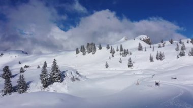 Flight over a snowy mountains in winter - wonderful Swiss Alps
