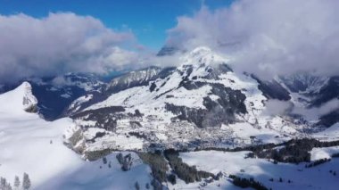 Great winter landscape - flight over snow capped mountains