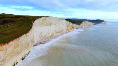 Flight over the white cliffs at the English coast clipart