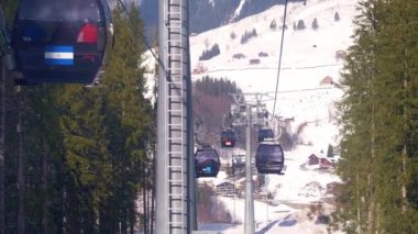 Ride in a cable car in the Alps on a winters day - ENGELBERG, SWITZERLAND - FEBRUARY 5. 2020