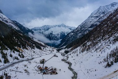 Snow covered mountains - a winter s day in the Alps - aerial view