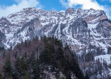Snow covered mountains - a winter s day in the Alps - aerial view