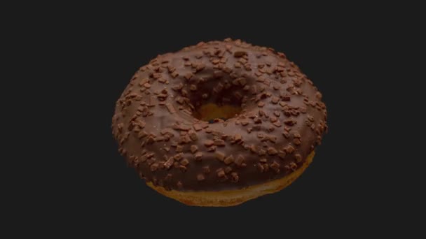 Donut - närbild av en choklad munk stopp trick skott — Stockvideo