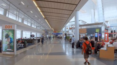 Departure Gates at Dallas Fort Worth Airport - DALLAS, UNITED STATES - JUNE 20, 2019 clipart