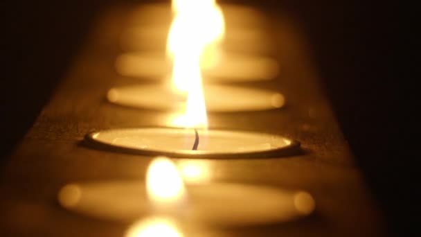 Candles in a row - beautiful macro shot — Stock Video