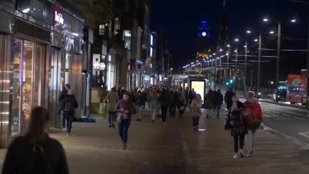 Pedestrians walking at Princes Street Edinburgh at night — Stock Video