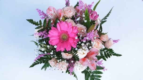 view from above, Flowers, bouquet, rotation on white background, floral composition consists of gerbera, Eustoma, Rose yana creamy, Alstroemeria, solidago, gypsophila, Arachniodis, Rose