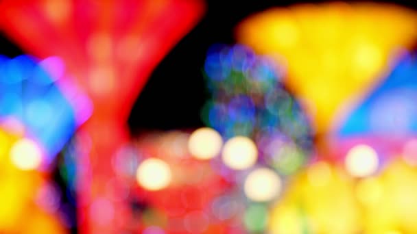 Beautiful background of multicolored illumination. close-up, blurred, soft focus. Defocused abstract bokeh lights , Multicolor illuminated background — Stock Video