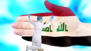 Tıbbi maskeli ve eldivenli hemşire, Irak bayrağı renginde boyanmış büyük elleri yıkıyor. Ulusal sağlık hizmetleri. Ellerinizi yıkayın. Virüs koruması. Hastalıkların önlenmesi.