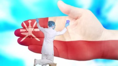 Tıbbi maskeli ve eldivenli hemşire, Umman bayrağı renginde boyanmış büyük elleri yıkıyor. Ulusal sağlık hizmetleri. Ellerinizi yıkayın. Virüs koruması. Hastalıkların önlenmesi.