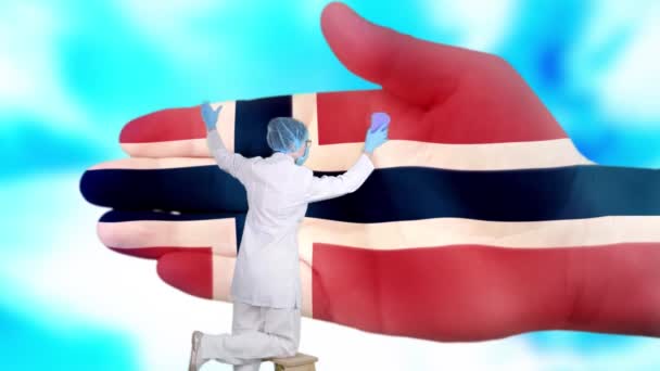 Nurse in medical mask and gloves washes large hand, painted in colors of Norway flag. State care for nation health. Wash your hands concept. Viruses protection. Diseases prevention. — Stock Video