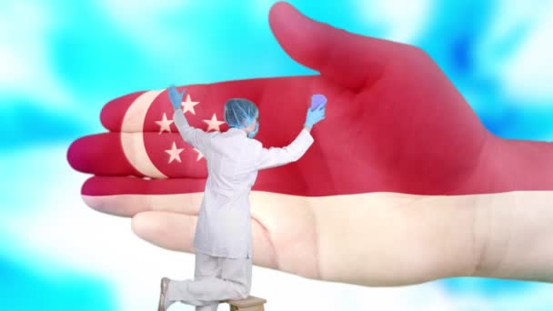 Infermiera in maschera medica e guanti lava grande mano, dipinta nei colori della bandiera di Singapore. Assistenza statale per la salute della nazione. Lavati le mani. Protezione dai virus. Prevenzione delle malattie . — Video Stock