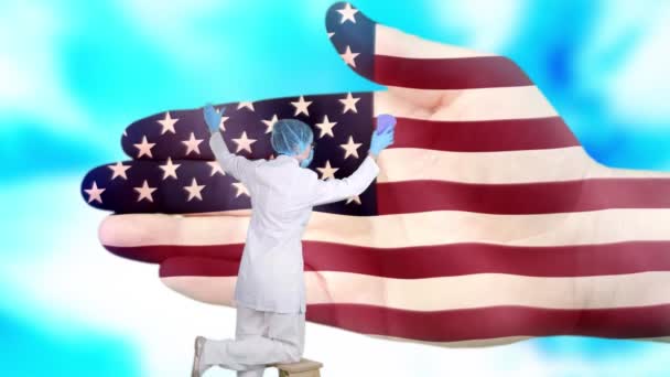 Krankenschwester mit medizinischer Maske und Handschuhen wäscht große Hand, bemalt in den Farben der US-Flagge. Der Staat sorgt für die Gesundheit der Nation. Waschen Sie sich die Hände. Virenschutz. Prävention von Krankheiten. — Stockvideo