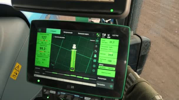 CHERKASY, UKRAINE, APRIL 28, 2020: view from tractor cab. close-up of monitor for tracking quality of sowing corn with automatic seeder. modern technologies in agriculture — Stock Video