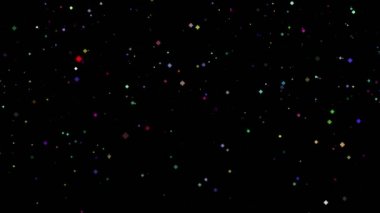 Soyut büyülü arkaplan. Eşkenar dörtgen şeklinde ışıldayan parlak parçacıklar siyah arkaplana düşüyor. Uçan, titreyen ışık parçacıkları, ışıltılar