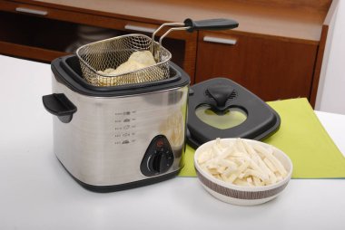 Household appliance - electric fryer pot. clipart