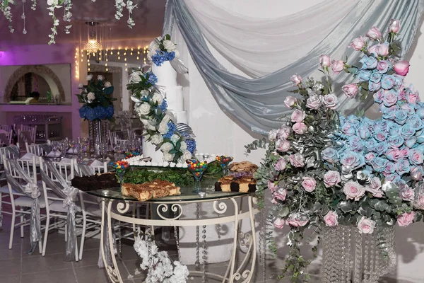 Decoration of social events; Individual dessert table for the guests at the wedding reception.