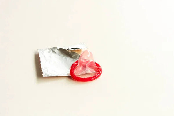 Color condom on white background — Stock Photo, Image