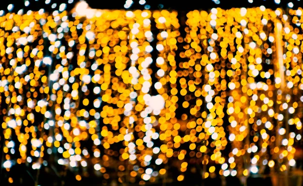 Bokeh in gold and white, sparkling background, festive with the — Stock Photo, Image