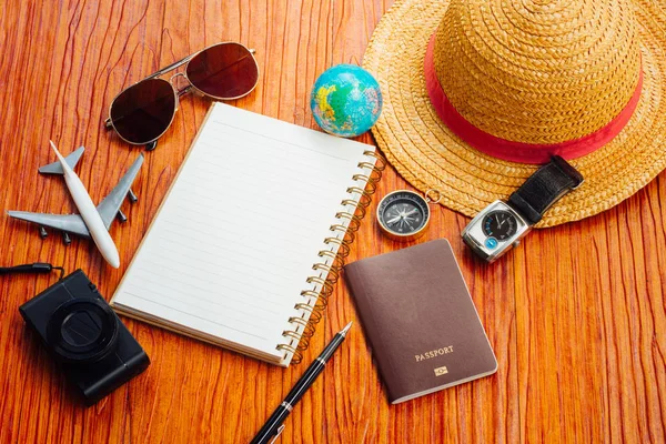 Travel Blogger accessories on wood copy space