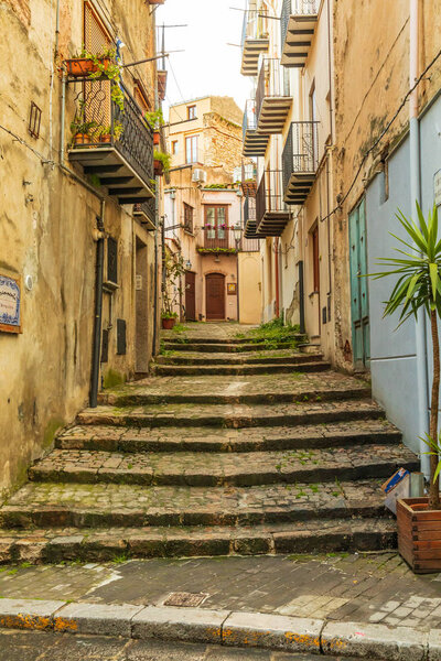 Italy, Sicily, Palermo Province, Castelbuono. Stairs on a narrow street in Castelbuono.