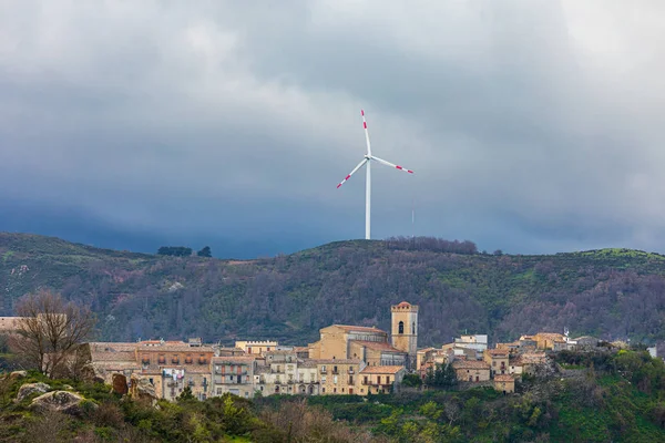 Italy, Sicily, Messina Province, Montalbano Elicona. Wind turbine on a hill above the town of Montalbano Elicona.